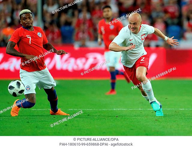 8 June 2018, Poznan, Poland: Soccer, Friendly Match Poland vs. Chile at the INEA Stadium Poznan: Junior Fernandes (L) of Chile and Michael Pazdan (R) from...
