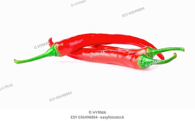 Three red chilli peppers isolated on white background