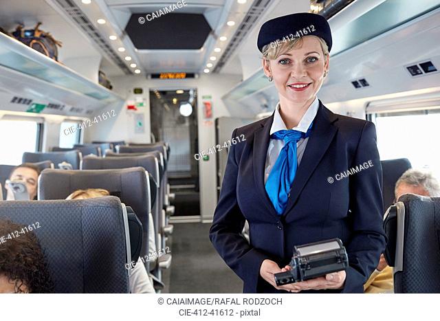 Portrait confident female attendant on passenger train