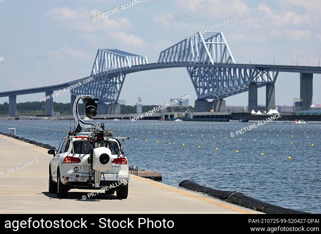 25 July 2021, Japan, Tokio: Rowing: Olympics, men , double sculls, semifinals in the Sea Forest Waterway. A camera car drives along the regatta course