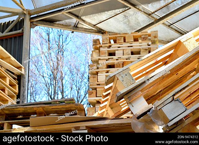Waste wood from pallets stacked in the storage room