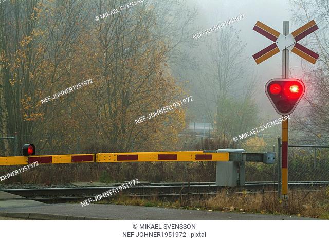 Railway crossing with red light, Molndal, Vastergotland, Sweden