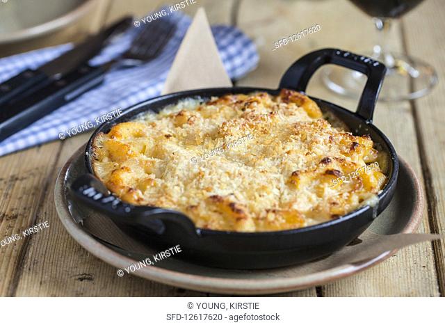Macaroni Cheese served in a black cast iron dish