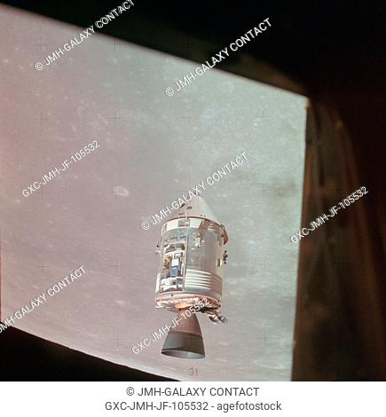 A view of the Apollo 15 Command and Service Modules (CSM) in lunar orbit as photographed from the Lunar Module (LM) Falcon just after rendezvous