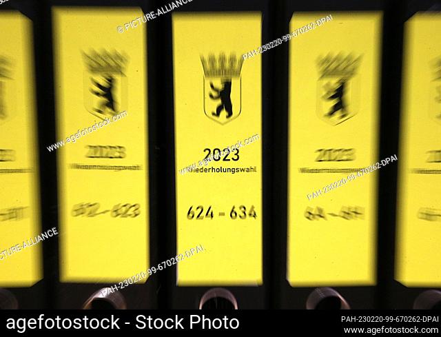 20 February 2023, Berlin: Folders of election documents stand on a table in the Lichtenberg district before the district election officer announces the official...