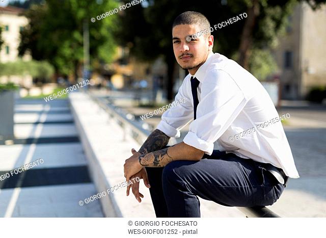 Businessman with tattoo Stock Photos and Images | agefotostock
