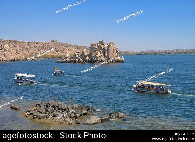 Tourist excursion boats off Philae Island, reservoir, Aswan, Egypt, Africa