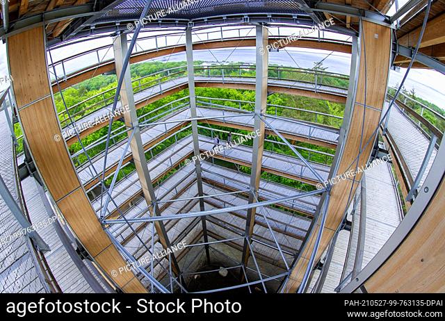 27 May 2021, Mecklenburg-Western Pomerania, Heringsdorf: Employees walk up the 33-metre-high wooden observation tower on the 1