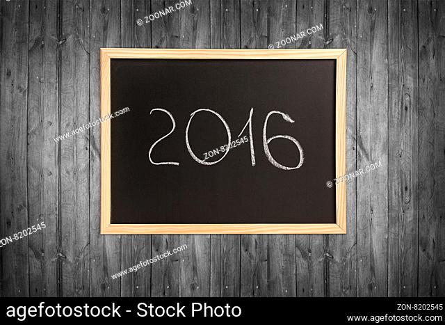 Chalkboard, wooden frame with year isolated on white