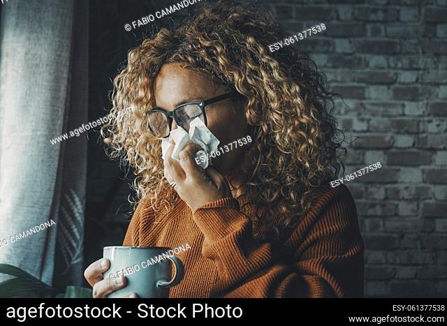 One woman sneezing nose with fever and influenza virus health disease. Flu and cold for winter temperature at home. People suffering for unhealthy bad condition...