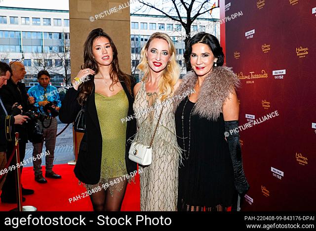 07 April 2022, Berlin: Isabella Maria Ahrens (l-r), Lana Müller and Mariella Ahrens arrive at the opening of Madame Tussaud's new ""Golden 20s"" themed area