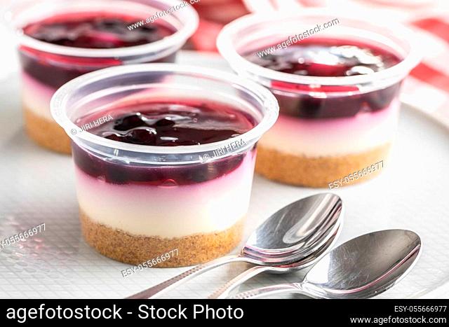 Sweet desssert. Cheesecake cup on plate