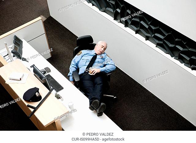 Security guard sleeping at desk