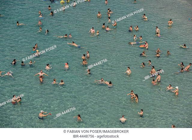 Tourists at the Playa Mal Pas, Benidorm, Province of Alicante, Costa Blanca, Spain