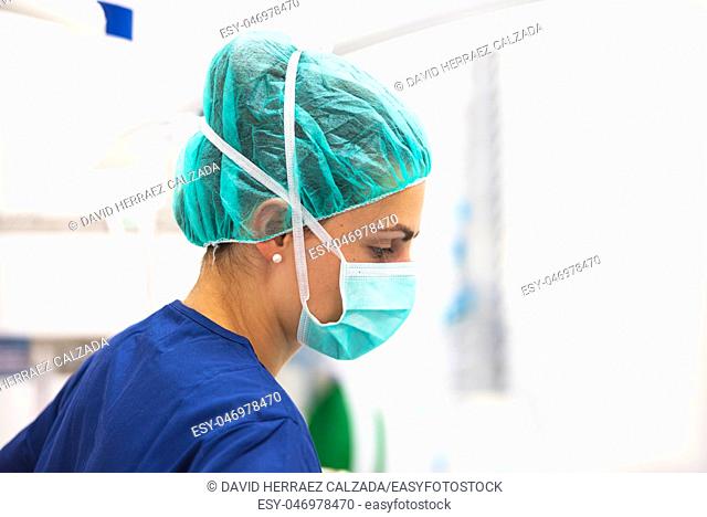 portrait of nurse with mask in surgery room at the hospital