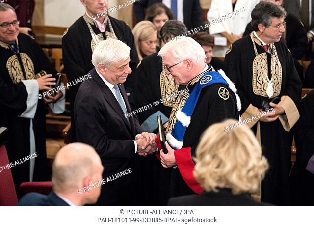11 October 2018, Greece, Athens: Prokopis Pavlopoulos (l), President of Greece, congratulates Federal President Frank-Walter Steinmeier on receiving an honorary...