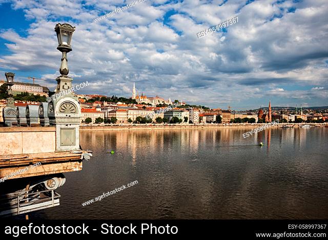 Danube River in city of Budapest in Hungary, Buda skyline, lantern on Szechenyi Chain Bridge on the left