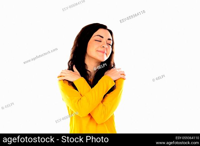 Adorable teenage girl with yellow sweater isolated on a white background