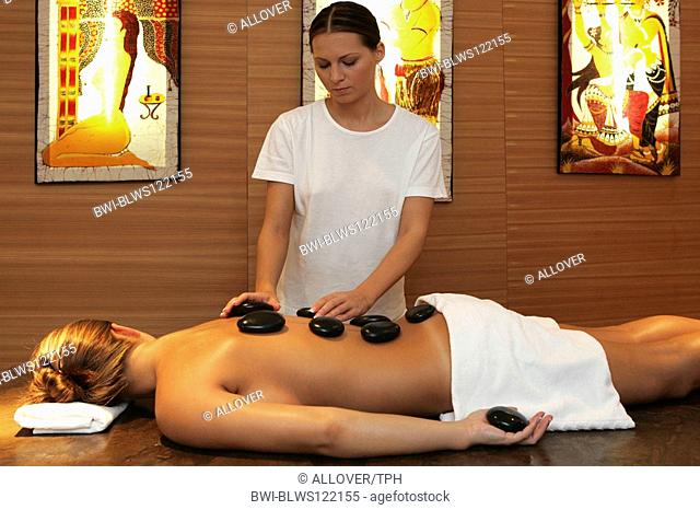 woman relaxing having a hot stone, lastone therapy