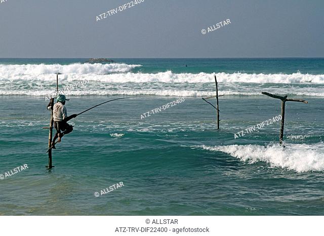 LONE STILT FISHERMAN; WELIGAMA, SRI LANKA, ASIA; 18/03/2013