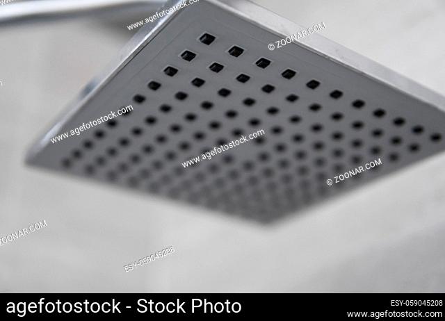 Square shower head in a modern bathroom. Shower in the bathroom with water spray or water. Feel relaxed and enjoy in the bathroom