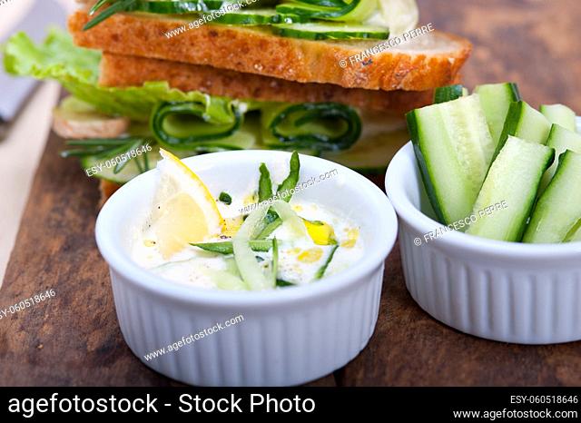 fresh vegetarian sandwich with garlic cheese dip salad on rustic table