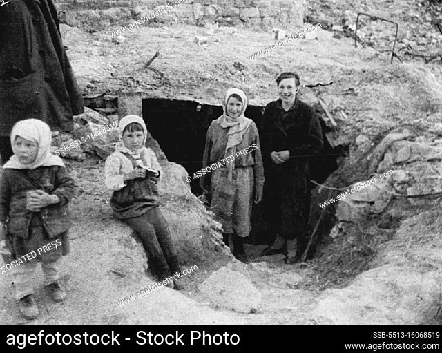 Stalingrad Cave Dwellers This Russian family, consisting of father, mother and two children, stands outside its cave home in Stalingrad this April