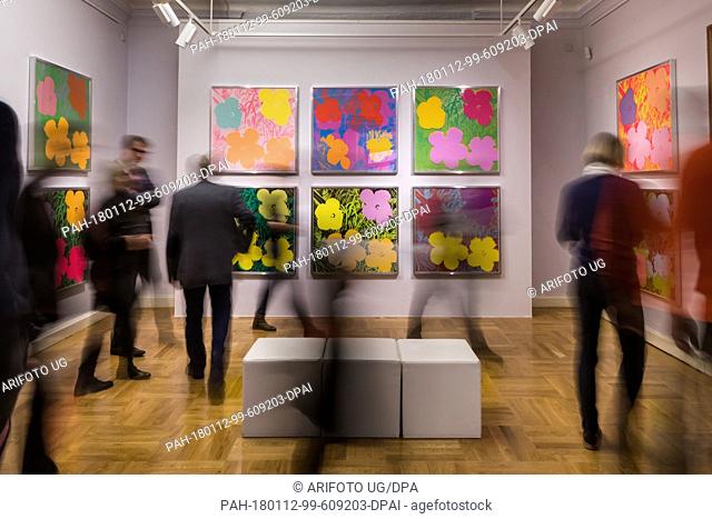 Visitors looking at pictures in the ""Andy Warhol - The Original Silkscreens"" exhibition at the art gallery in Apolda, Germany, 12 January 2018