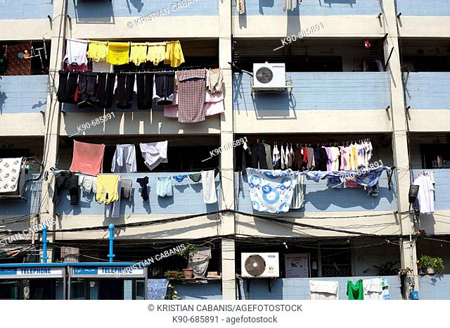 Laundry hanging from balconies equipped with air conditions at residential buildings of middle class dwellers, Bangkok, Thailand, Southeast Asia