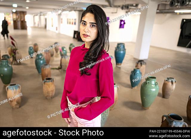07 October 2022, Berlin: Anahita Sadighi, Berlin gallery owner, sits in front of her installation ""Woman - Life - Freedom"" in the Kantgaragen