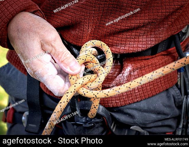 Tying a figure of eight to a rock climbing harness