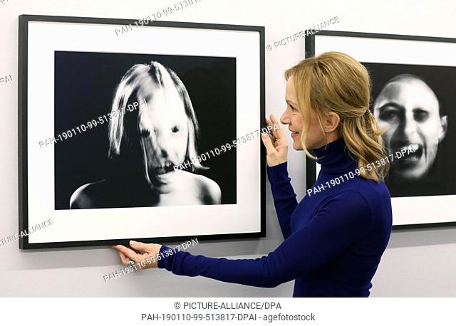10 January 2019, Mecklenburg-Western Pomerania, Rostock: Actress Katja Flint is standing next to her photo ""Anika"" (l, 2018)