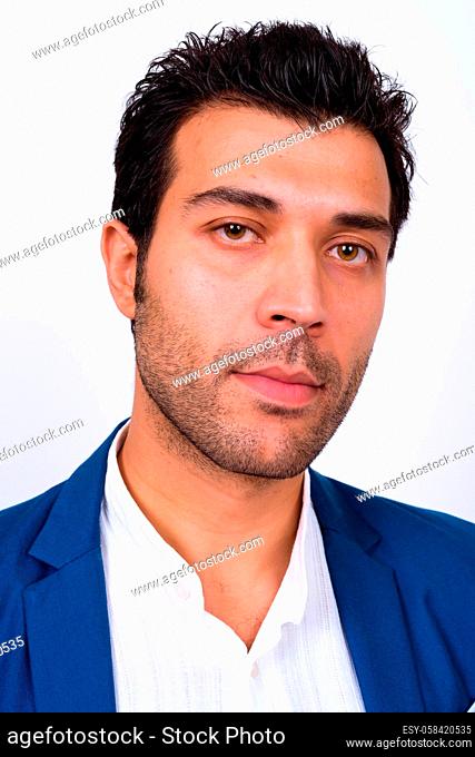 Studio shot of handsome Turkish businessman against white background