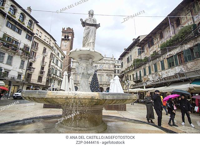 Verona Veneto Italy on November 24, 2019: Christmas in Verona streets. Roman fountain at Piazza delle Erbe