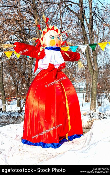 Samara, Russia - February 18, 2018: Holiday of Shrovetide in Russia. Disposable Shrovetide doll prepared for burning at the winter farewell festival Maslenitsa