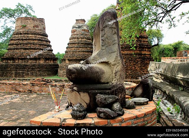 Stupas and headless statue of Buddha in Ayutthaya, Thailand