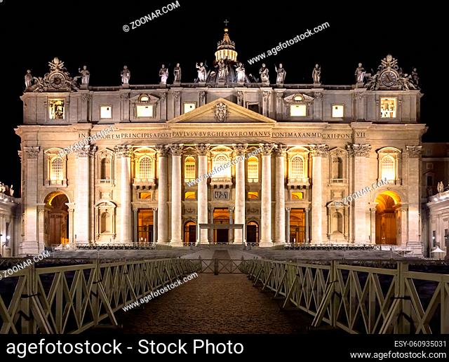 Papal Basilica of Saint Peter in Vatican City illuminated by night, designed by Michelangelo and Bernini
