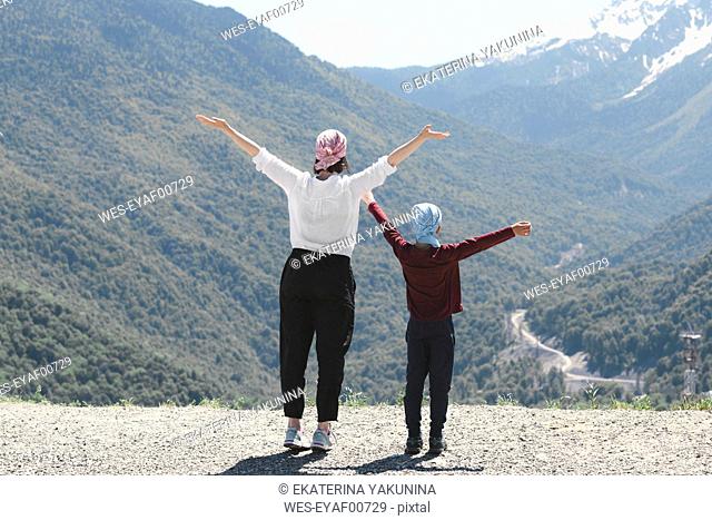 Mother and son enjoying mountain view, Sochi, Russia