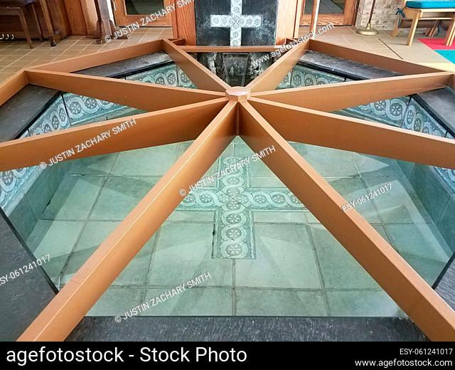 tile and wood baptism pool with cross