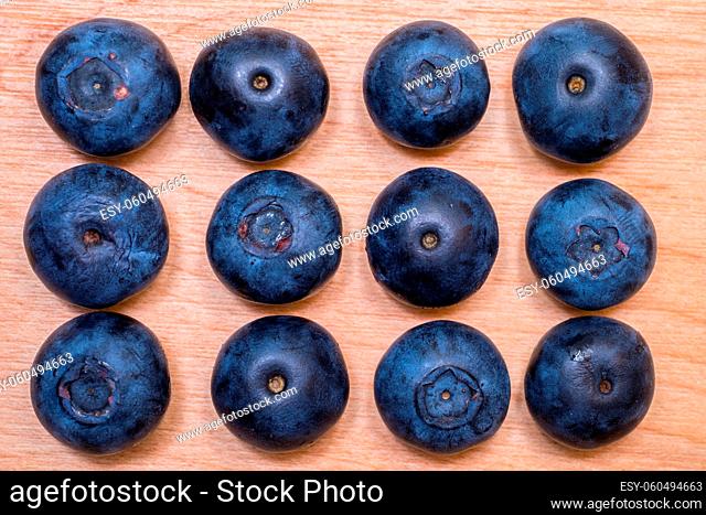 Overhead view of fresh blueberries arranged on a table top
