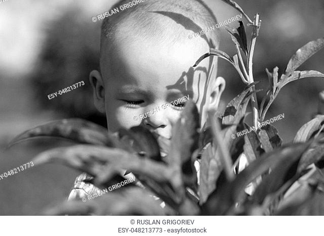 Black white photo happy mother and toddler son on nature background