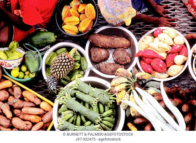 Close up of the perishables for sale during market day on the boat: string beans, eggplant, potatoes, pineaple, starfruit, taro, bananas