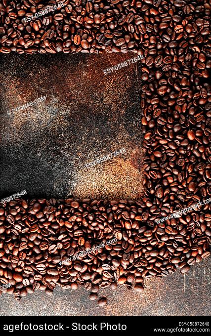 Black coffee beans studio shot. Freshly roasted coffee beans as texture background. Frame of coffee beans with copy space for text