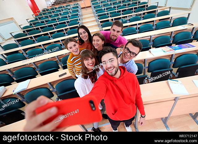 Selfie time international students with beaming smiles are posing for selfie shot