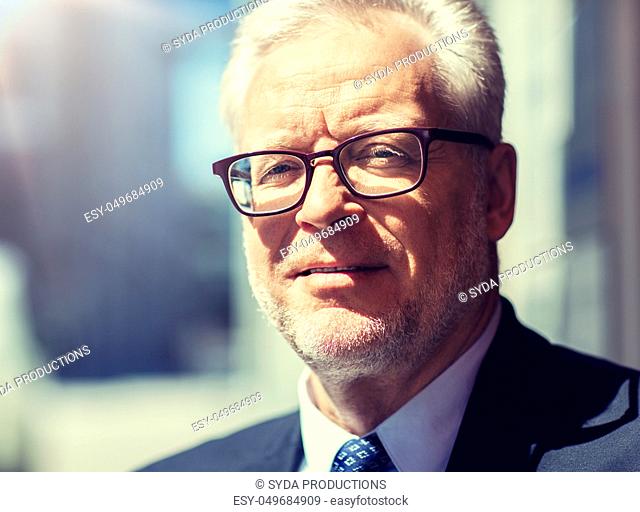 close up of senior businessman in eyeglasses