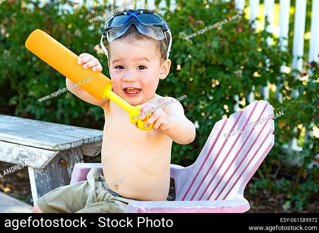 Happy Playful Young Mixed Race Chinese and Caucasian Boy Wearing Swimming Goggles