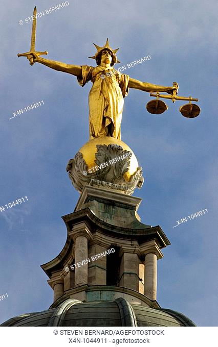 Scales of Justice statue on top of The Old Bailey central criminal court, London, UK  Designed by E W  Mountford