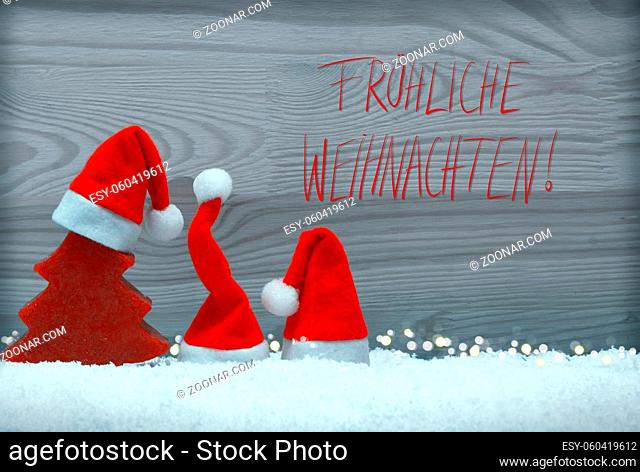 Christmas background with red hat , fir tree isolated on wood . Snow background