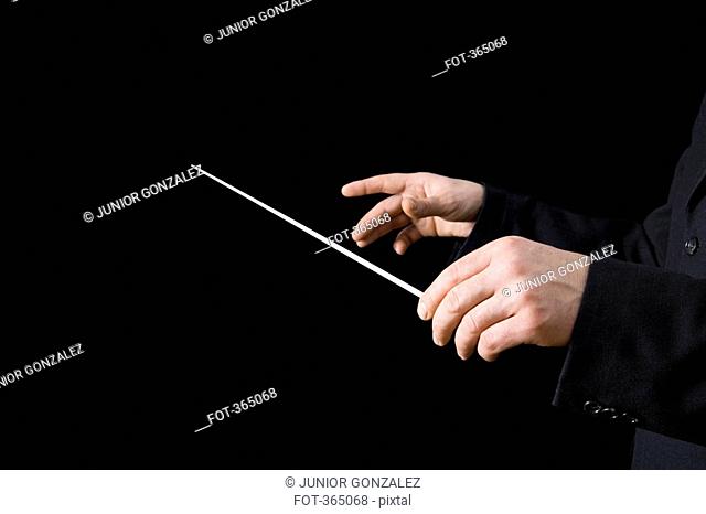 Conductor holding a baton