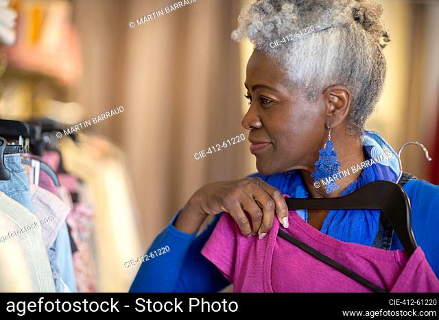 Senior woman shopping in clothing boutique